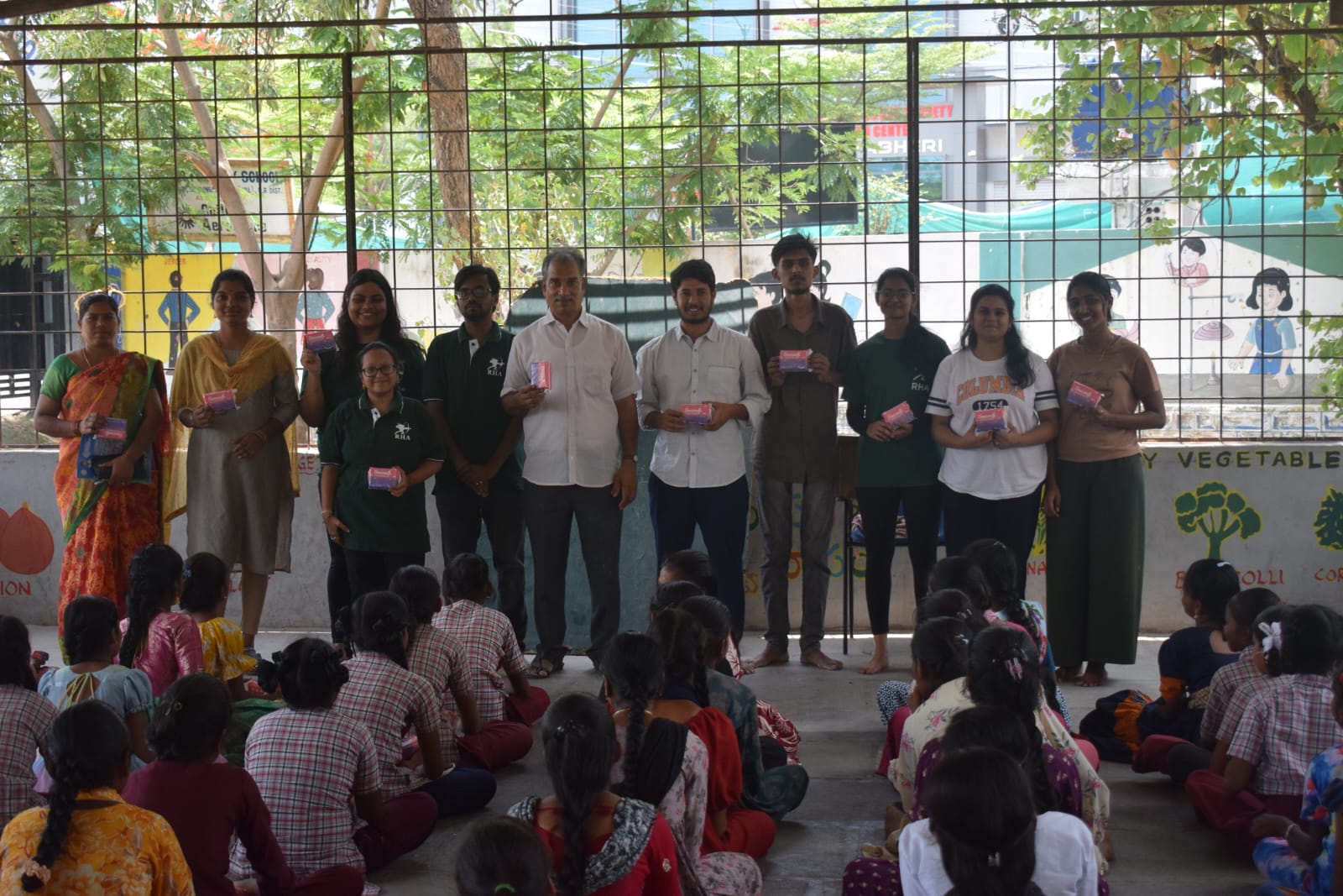 LLI team with students during a school distribution drive